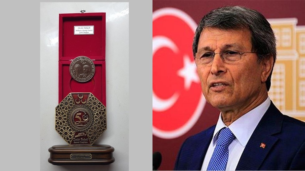 MHP Yusuf Hala&ccedil;oğlu'na plaket verdi!